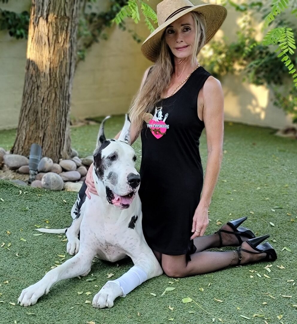 A woman and her dog pose for the camera.