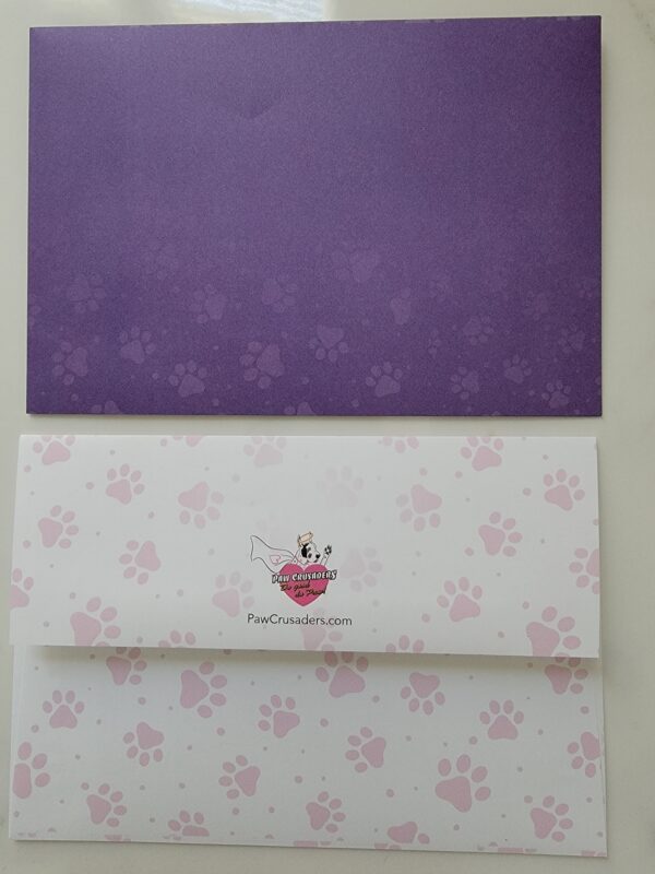 A purple envelope and pink paper with the words " hello kitty ".